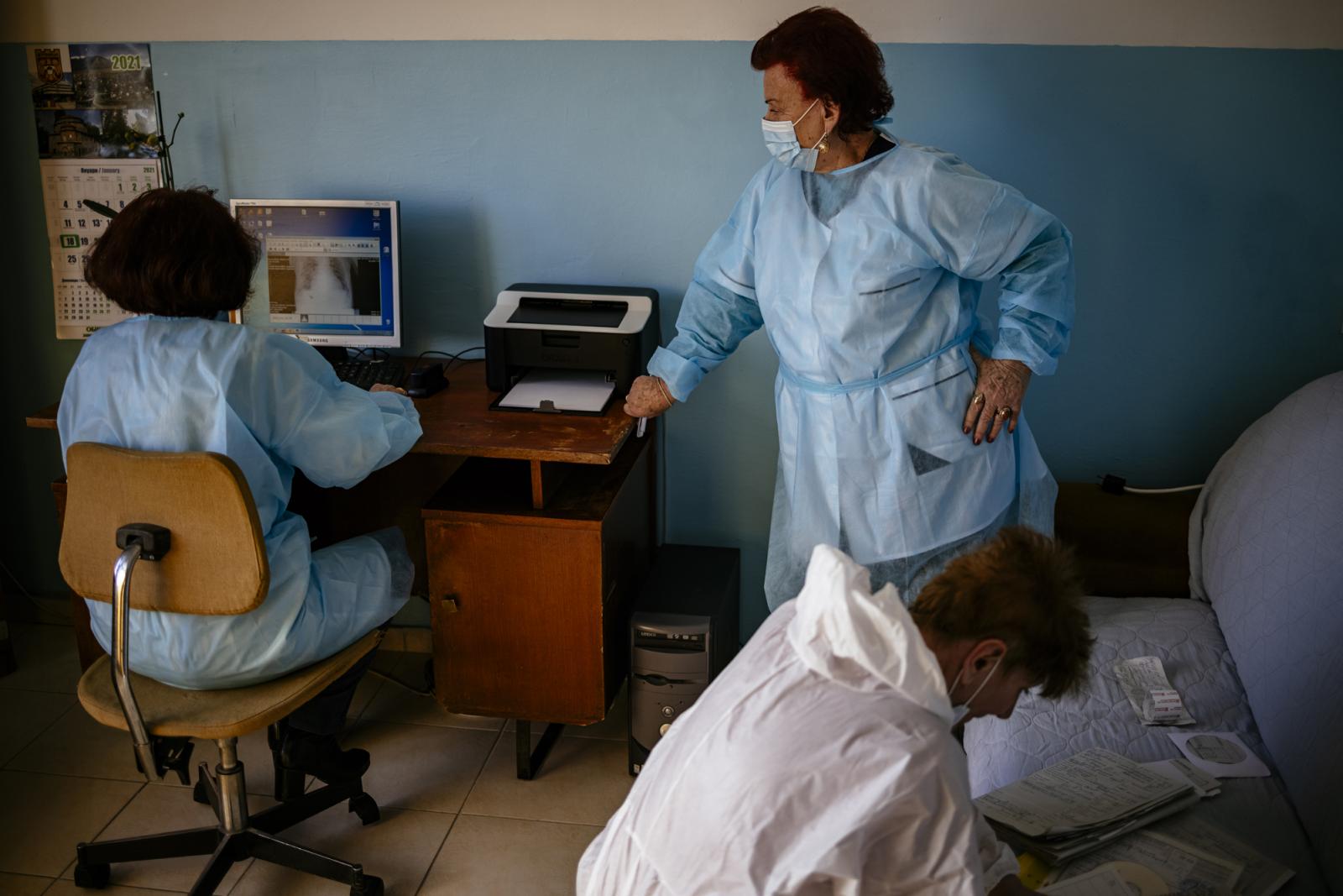 This picture taken on January 20, 2021 shows Bulgarian Infection disease specialist Dr Maria Bogoeva, 82, taking a short break during her shift in a Covid-19 unit in the hospital of Doupnitsa, a municipality with 50,000 inhabitants which is desperately la