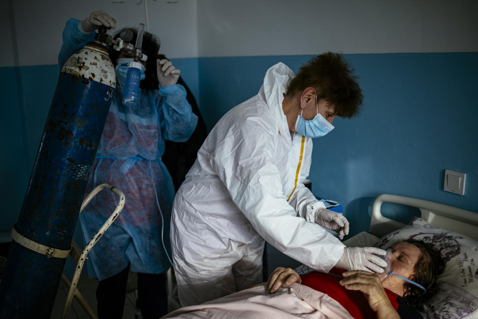 This picture taken on January 20, 2021 shows Bulgarian Infection disease specialist Dr Maria Bogoeva, 82, taking a short break during her shift in a Covid-19 unit in the hospital of Doupnitsa, a municipality with 50,000 inhabitants which is desperately la