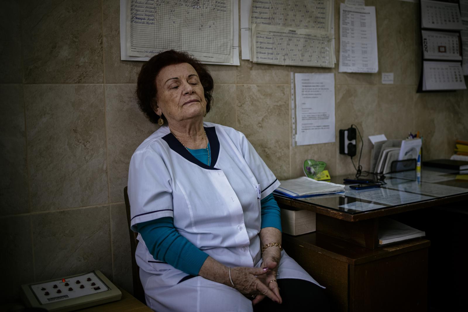 This picture taken on January 20, 2021 shows Bulgarian Infection disease specialist Dr Maria Bogoeva, 82, taking a short break during her shift in a Covid-19 unit in the hospital of Doupnitsa, a municipality with 50,000 inhabitants which is desperately la