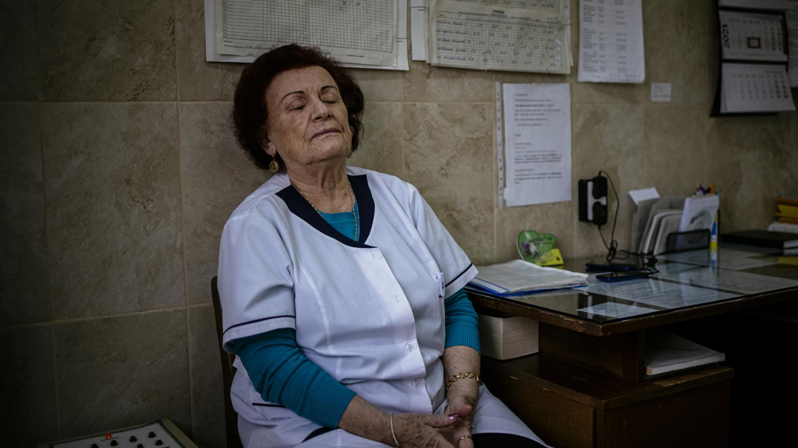 This picture taken on January 20, 2021 shows Bulgarian Infection disease specialist Dr Maria Bogoeva, 82, taking a short break during her shift in a Covid-19 unit in the hospital of Doupnitsa, a municipality with 50,000 inhabitants which is desperately la